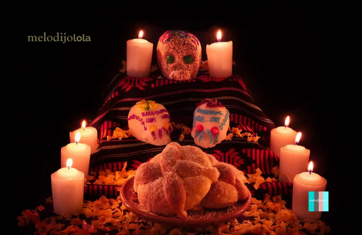 Qué significan las veladoras y velas en el altar de muertos 